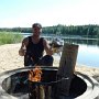 There is a open fireplace in the beach of Cottage Jokiniemi
